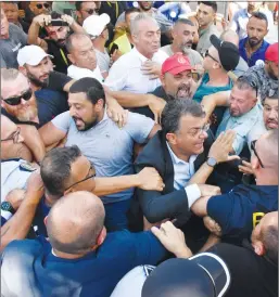  ?? Photo: Kıbrıs ?? Scuffles broke out between police and demonstrat­ors outside Parliament on Wednesday