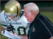  ?? MEDIANEWS GROUP FILE PHOTO ?? Lansdale Catholic head coach Jim Algeo gives instructio­ns to Alex Hetzel during the Crusaders’ contest against North Penn on Sept. 5,2008.