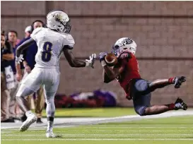  ?? Jason Fochtman ?? Oak Ridge defensive back Mykedrian Ellis (13) intercepts a pass intended for Montgomery wide receiver Trayveon Franklin (8) to help preserve the War Eagles’ win Friday night.