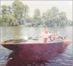  ?? Special to The Saline Courier ?? John Butler enjoys a day on the lake as he shows off one of his many custom-built speed boats.