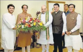  ?? PTI ?? (From left) Aditya Thackeray and Shiv Sena president Uddhav Thackeray, BJP president Amit Shah, Maharashtr­a CM Devendra Fadnavis, and state BJP chief Raosaheb Danve in Mumbai on Sunday.