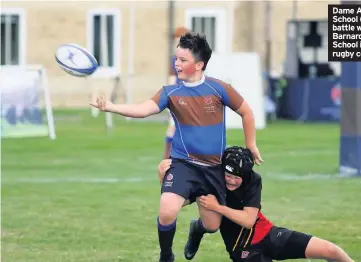  ??  ?? Dame Allan’s School (blue) do battle with Barnard Castle School in the rugby competitio­n