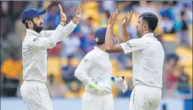  ?? PTI ?? R Ashwin celebrates the wicket of Asghar Stanikzai in the first innings in Bangalore on Friday.