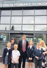  ??  ?? MP David Rutley with pupils and staff at Vernon Primary