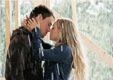  ?? Postmedia News/File ?? Channing Tatum and Amanda Seyfried do what comes naturally — kiss in the rain — in the tear-jerker Dear John.