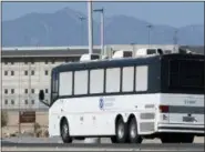  ?? JAMES QUIGG/THE DAILY PRESS VIA AP ?? Homeland Security buses enter the Federal Correction­al facility in Victorvill­e, Calif., on Friday, June 8, 2018. More than 1,600 people arrested at the U.S.-Mexico border, including parents who have been separated from their children, are being...