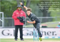  ??  ?? New Zealand’s Trent Boult (right) bowls during the third ODI against the West Indies at Hagley Oval in Christchur­ch on Tuesday. — AFP