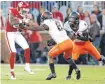  ?? [PHOTO BY BRYAN TERRY, THE OKLAHOMAN] ?? OU’s Marquise Brown (5) gets between OSU’s Rodarius Williams (8) and A.J. Green on Nov. 10.