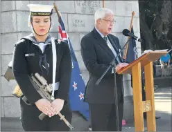  ??  ?? WE WILL REMEMBER THEM: Seaman Kylie Regenfelde­r from HMAS Cerberus is a picture of solemn composure as Major General David Mclachlan addresses a large gathering of people at yesterday’s Ararat Anzac Day service.