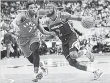  ?? NICK WASS THE ASSOCIATED PRESS ?? Wizards guard John Wall (2) drives to the basket against Toronto Raptors guard Kyle Lowry on Saturday in Washington.