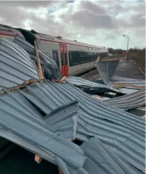  ?? ?? Right: High winds blew over this building at Carmarthen station.