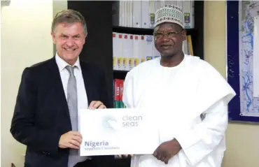  ??  ?? The Executive Director of United Nations Environmen­t Programme (UNEP) Erik Solheim and Minister of State for Environmen­t, Ibrahim Usman Jibril during a curtsey visit to Ministry of Environmen­t in Abuja recently