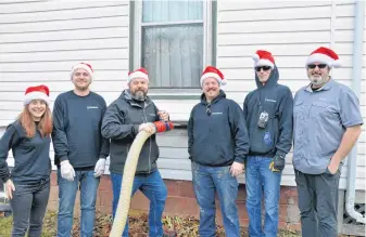  ?? KIRK STARRATT PHOTOS ?? Meghan Somerville, Sean Dorey, Dave Brake, Chris Beaver, Jason Gillis, Dwayne Jones and others from Thermo Homes in Kentville warmed a Steam Mill woman’s heart and home this holiday season.