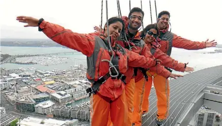  ??  ?? Kruthi Suresh experience­s a SkyWalk on Auckland’s Sky Tower.