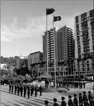  ?? ZHANG JINJIA / XINHUA ?? A flag-raising ceremony is held in Macao on Wednesday to celebrate the 18th anniversar­y of the special administra­tive region’s return to the motherland.