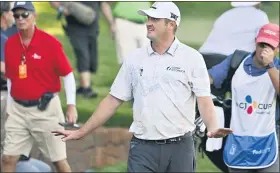  ?? DAVID BECKER — THE ASSOCIATED PRESS ?? Jason Kokrak walks off the 18th hole after completing the final round of the CJ Cup tournament Sunday. He won by two strokes for his first PGA Tour victory in 233starts.