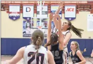  ?? Diana Jost ?? Heritage’s Sydnee St. John puts up a shot in the paint during Saturday’s rivalry game with Gordon Lee.