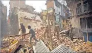  ??  ?? Members of the Nepalese army clear debris after demolishin­g the remains of collapsed houses in Kathmandu on Friday. REUTERS