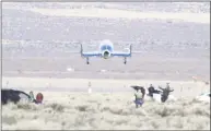  ?? Associated Press ?? Virgin Galactic’s VSS Unity lands at Mojave Air and Space Port after reaching space in February in Mojave, Calif.