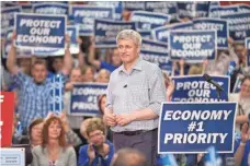  ?? PHOTOS BY GEOFF ROBINS, AFP/GETTY IMAGES ?? Conservati­ve leader Stephen Harper, shown here at a rally in London, Ontario, on Tuesday, has been prime minister for 10 years.