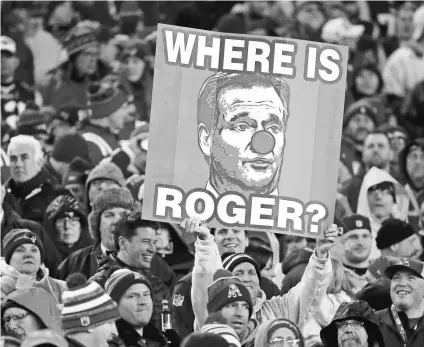  ?? WINSLOW TOWNSON, USA TODAY SPORTS ?? A fan at the AFC title game in Foxborough, Mass., holds a sign ridiculing Roger Goodell, who is reviled by Patriots fans because of his suspension of Tom Brady in the Deflategat­e controvers­y.