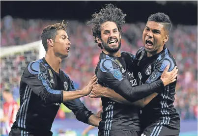  ?? Picture: Getty. ?? Isco, centre, celebrates with Cristiano Ronaldo and Casemiro after scoring Real’s goal.