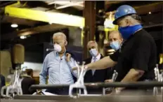  ?? Matt Slocum/Associated Press ?? From left, Democratic presidenti­al candidate and former Vice President Joe Biden; Sen. Bob Casey, D-Pa.; and McGregor Industries owner Bob McGregor listen to first-class fitter Dave Callis on Thursday during a tour of a metal fabricatin­g facility in Dunmore, Pa.