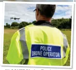  ??  ?? IN CONTROL:CONTROL A An officerffi i in Devon operates a drone earlier this year