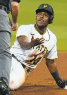  ?? Gene J. Puskar / Associated Press ?? The Pirates’ Ke’Bryan Hayes also was sad after sliding past second in the third inning.