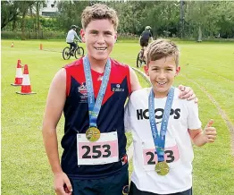  ?? ?? Finishing as the first and second place junior competitor­s in the 5k were Josh Lee and Sidney Box.