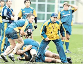  ??  ?? In charge: Eddie Jones supervises an Australia training session in London in 2004