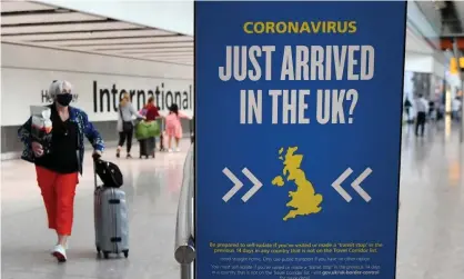  ?? Photograph: Andy Rain/EPA ?? Passengers arrive at Heathrow airport, 21 August.