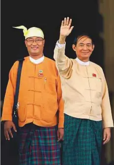  ?? AP ?? ■ Win Myint, newly elected president of Myanmar, waves to media outside parliament in Myanmar. Myanmar’s parliament has elected Myint as the new president.