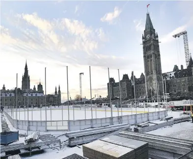  ?? JUSTIN TANG / THE CANADIAN PRESS ?? The rink on Parliament Hill in Ottawa. Outside of a planned peewee house league tournament, there will be no hockey allowed on the ice. Also no food, no rough housing, no tag, no figure or speedskati­ng, and no carrying of children.