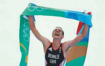 ?? Rex Features ?? Alistair Brownlee celebrates winning a gold medal at the 2016 Rio Games. He also won gold at the triathlon at London Olympics in 2012.