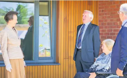  ??  ?? Visit HRH The Princess Royal meeting Gordon and Mary MacDonald who are tenants at the new developmen­t. Picture by Fraser Band