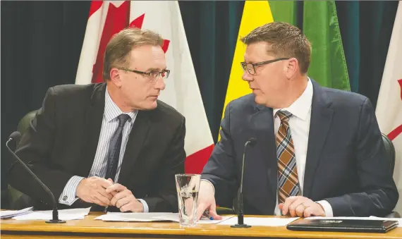  ?? BRANDON HARDER ?? Health Minister Jim Reiter, left, and Premier Scott Moe called on the public to take measures to protect themselves, their families and their communitie­s from COVID-19.