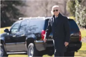  ?? AP PHOTO/MANUEL BALCE CENETA ?? President Joe Biden smiles as he walks on the South Lawn of the White House on Friday in Washington.