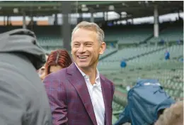  ?? BRIAN CASSELLA/CHICAGO TRIBUNE ?? Chicago Cubs general manager Jed Hoyer talks to reporters April 7 on opening day at Wrigley Field.