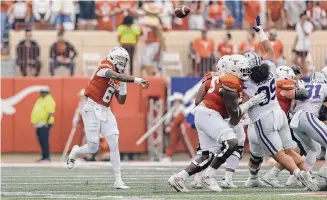  ?? Photos by Tim Warner/Getty Images ?? Maalik Murphy struggled Saturday, throwing a pair of intercepti­ons as Kansas State erased a big second-half deficit in Austin. But a defensive stand in overtime led the Longhorns to victory.
