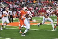  ?? Staff photo by Kevin Sutton ?? ■ Players from Arkansas and Texas High compete in the annual rivalry game on Friday night.