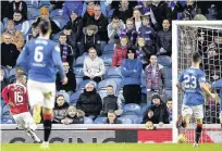  ??  ?? Opener David Templeton celebrates after putting Hamilton 1-0 ahead and silencing the big crowd at Ibrox