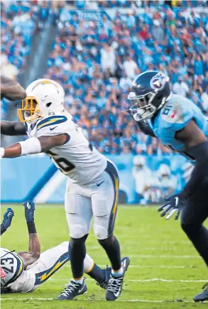  ?? PHOTO BY SILAS WALKER/GETTY IMAGES ?? Left: Tennessee Titans running back Derrick Henry (22) barrels into the season as an MVP candidate and is perhaps the best bet to become the first non-quarterbac­k since 2012 to win the NFL’s top award.