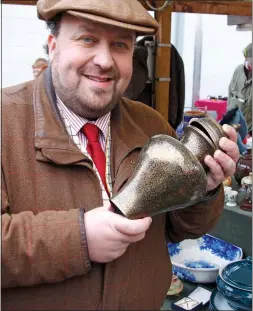  ??  ?? AWKWARD AUCTION: James Lewis and, below, an ivory-handled cane that was sold through his company