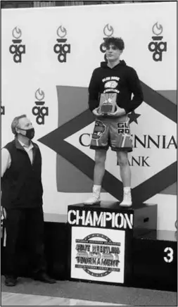  ?? Special to the MDR ?? Glen Rose sophomore Brayden Phillips stands atop the champions podium after receiving the Outstandin­g Wrestler Award during the state wrestling tournament. Phillips was able to pin his opponents throughout the tournament to be named state champion.