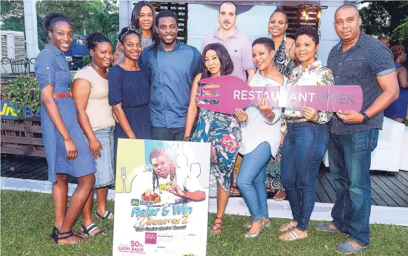  ?? CONTRIBUTE­D PHOTO ?? Chef Andre ‘Cooks’ Sewell (fourth left) is pictured with the 10 lucky patrons who were treated to dinner, courtesy of JN Bank, during the launch of Restaurant Week, held on the lawns of Devon House in St Andrew on Sunday, November 4.