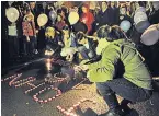  ??  ?? VIGIL Family &amp; community in West Belfast