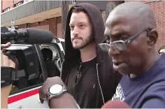  ?? KTRK-TV via AP ?? ■ In this image made from a Sunday video by KTRK-TV, Cody Wilson, left, walks out of the Harris County Jail in Houston. Wilson, the owner of a Texas company that sells plans to make untraceabl­e 3D-printed guns, is free on bond after being accused by authoritie­s of having sex with an underage girl.