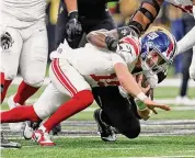  ?? Tyler Kaufman/Associated Press ?? New York Giants quarterbac­k Tommy DeVito is sacked by New Orleans Saints defensive end Tanoh Kpassagnon Sunday in New Orleans.