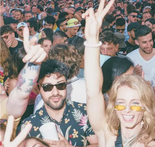  ?? SAMUEL ARANDA/THE NEW YORK TIMES ?? Crowds at Ushuaia, an outdoor megaclub in Ibiza, Spain.